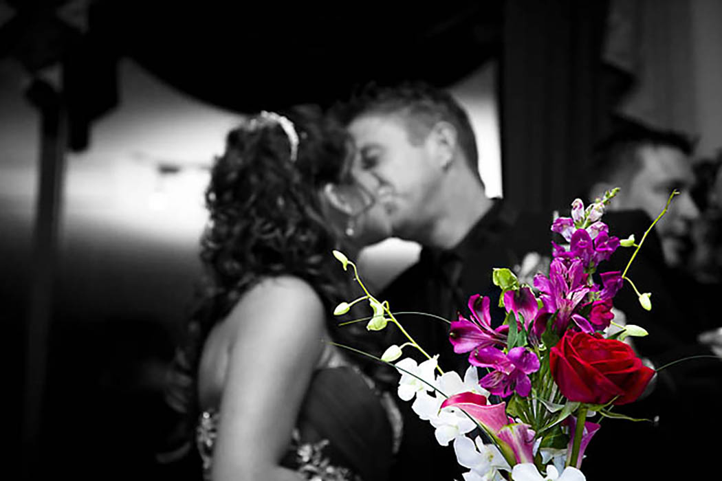 Bride and groom kissing